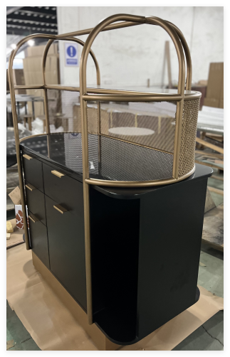 bespoke hotel furniture piece, a black cabinet with gold accents and a unique birdcage-like structure on top