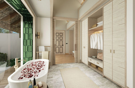 the Marriott hotel's brand ambiance of luxury and relaxation, featuring a spacious bathroom with a freestanding bathtub filled with rose petals and tailored furniture that complements the elegant design.jpg