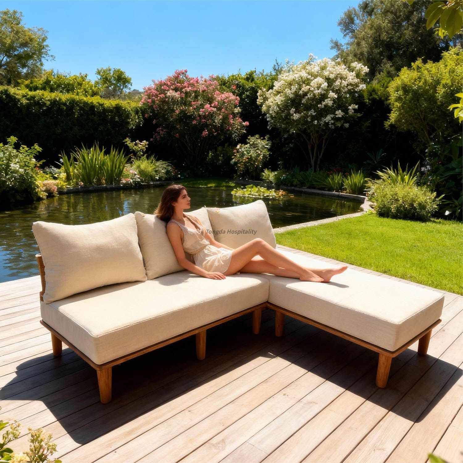  the outdoor leisure area of the hotel, a foreign beauty is sitting on an outdoor sofa to rest