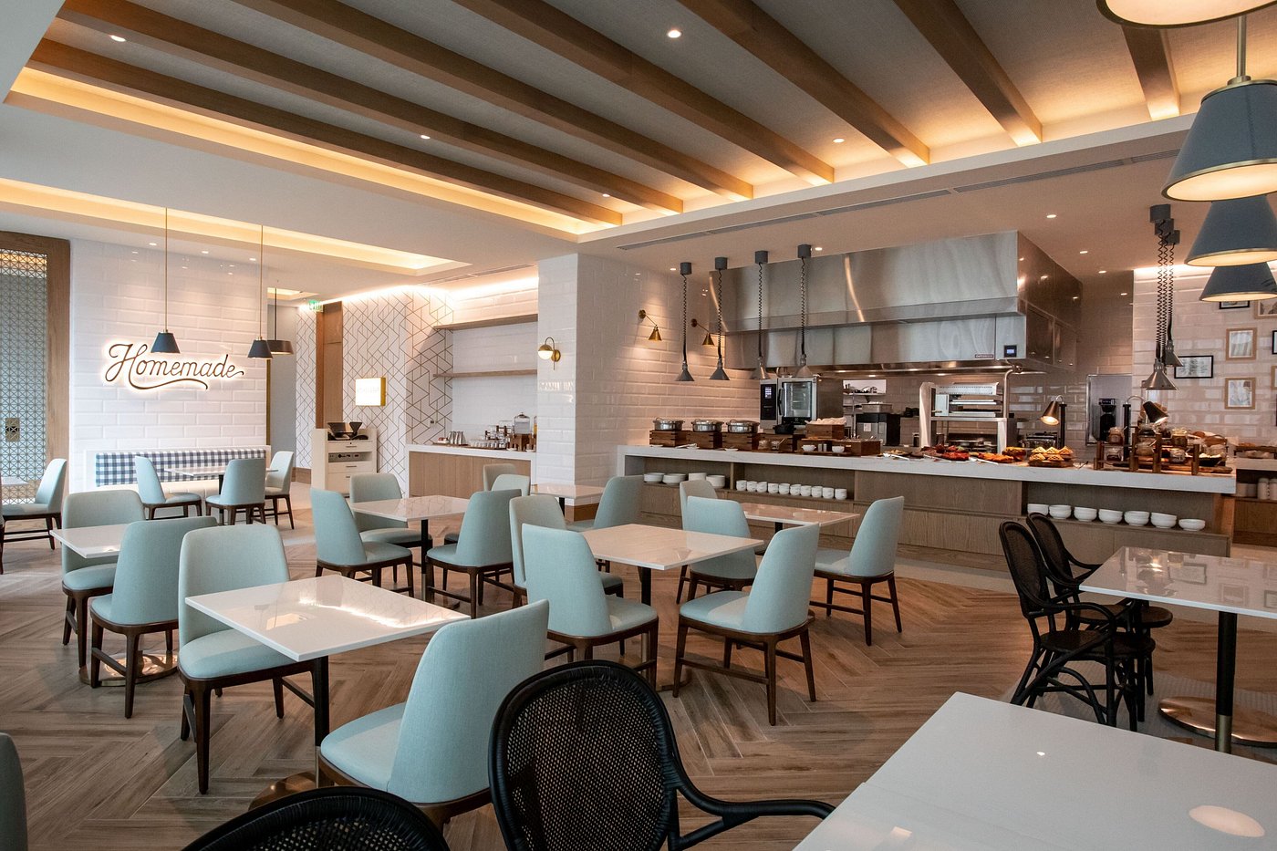 Restaurant dining space featuring mint green dining chairs and custom buffet tables by Tongda