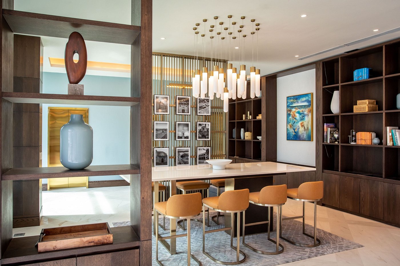 Custom public area hotel joinery including timber shelving and long communal desk by Tongda