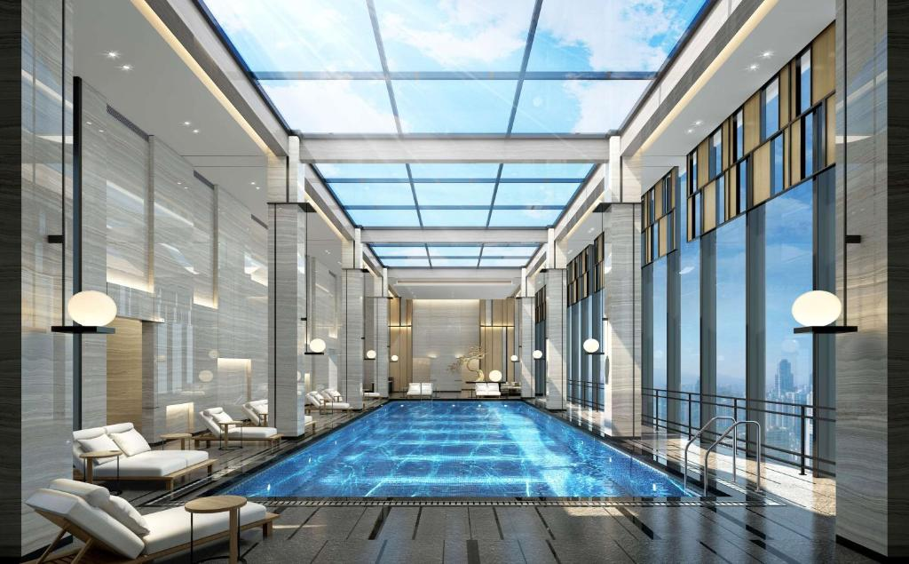 Poolside sofas, tables and sun loungers at Wyndham Changsha South