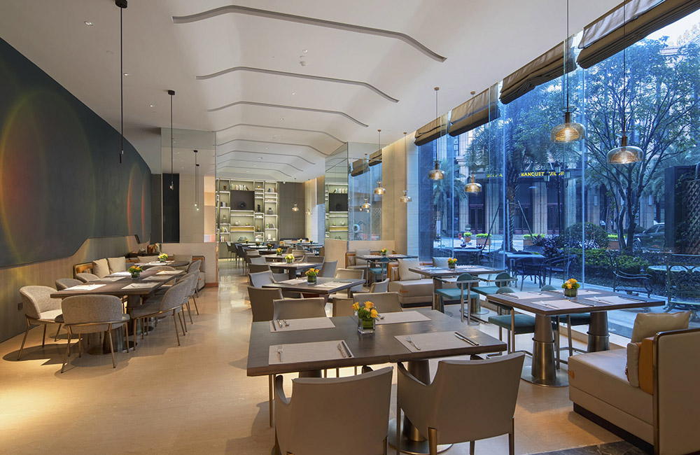 Restaurant banquette seating and decorative cabinets at Wyndham Changsha South