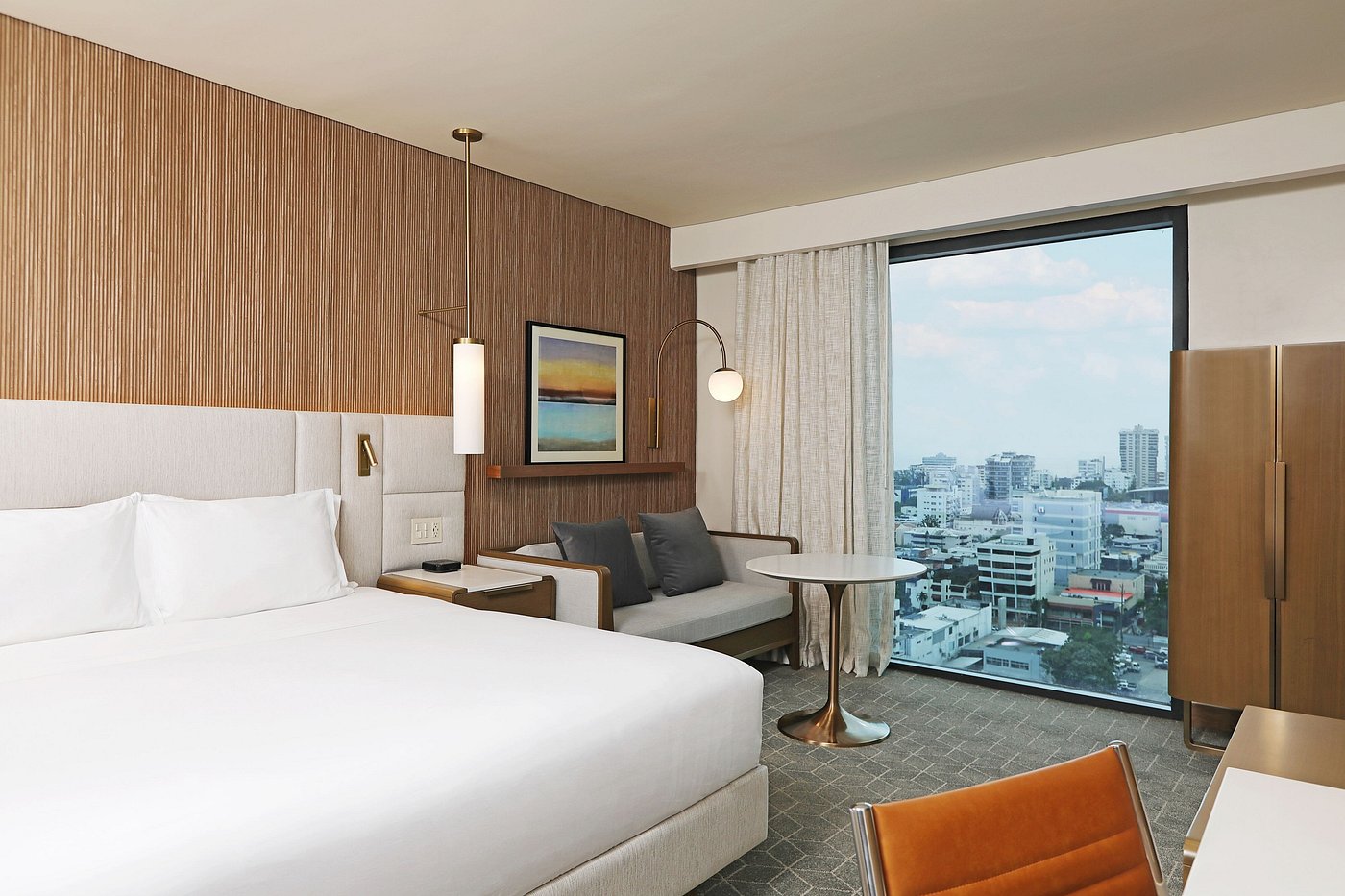 King guestroom featuring a bespoke guestroom loose furniture package, floating desk, and daybed